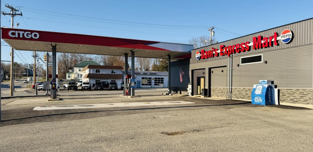Dani’s Express Mart — CITGO fuel canopy and store exterior, red signage and charcoal siding.